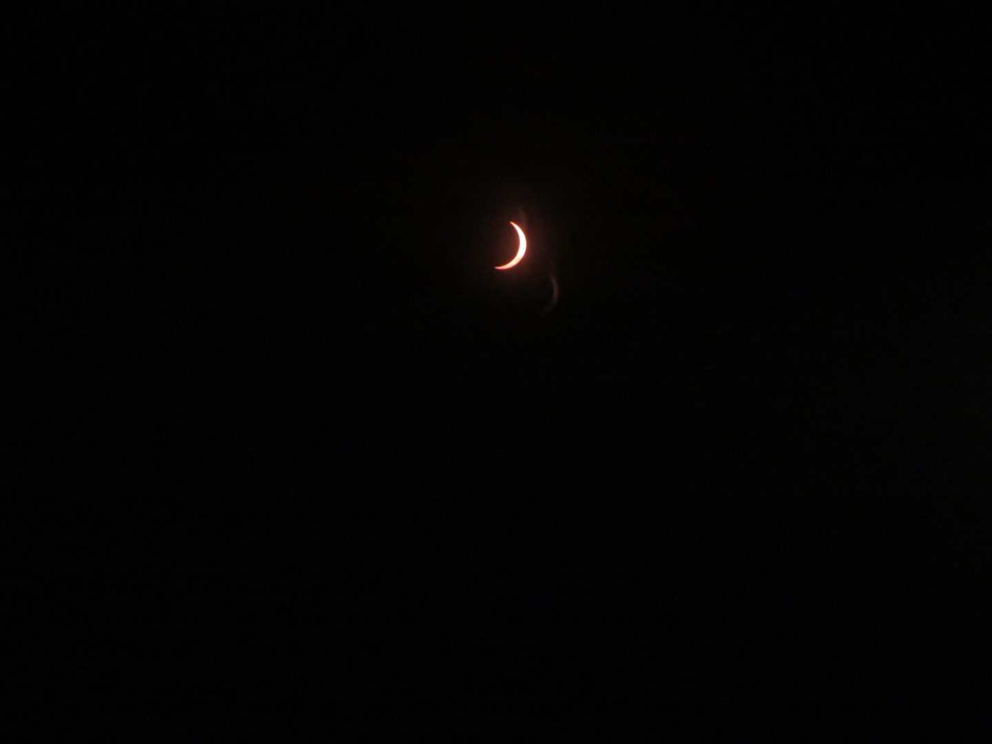Small crescent moon surround by black