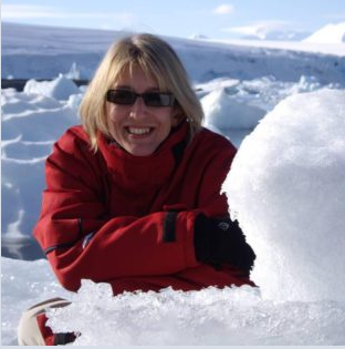 A person posing for the camera in the snow