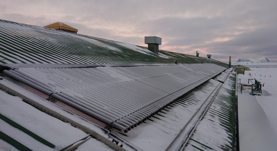 The roof of a building with solar panels