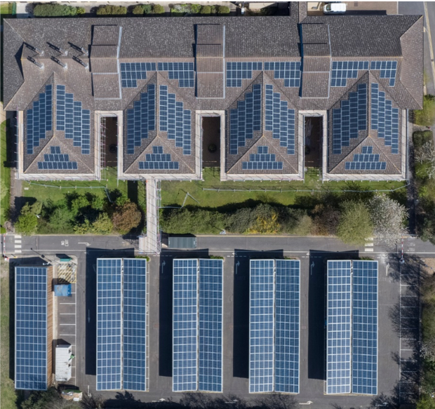 Aerial photo of a range of buildings with solar PV