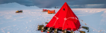 A red tent in a snowy landscape