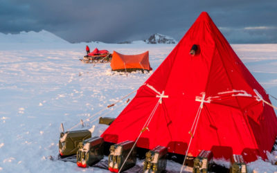 A red tent in a snowy landscape