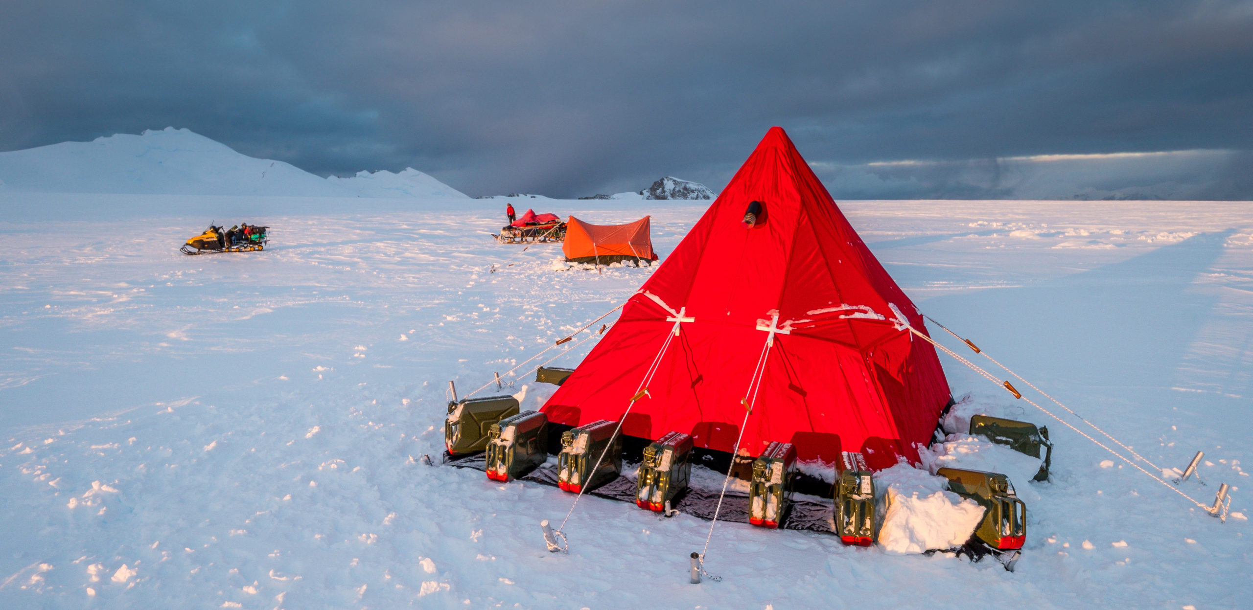 A red tent in a snowy landscape