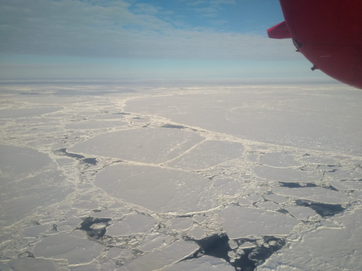 A airplane that is covered in snow