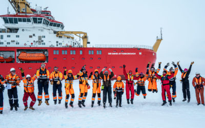 SDA crew celebrate successful trials on the sea ice in front of the ship