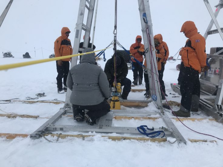 A group of people that are standing in the snow