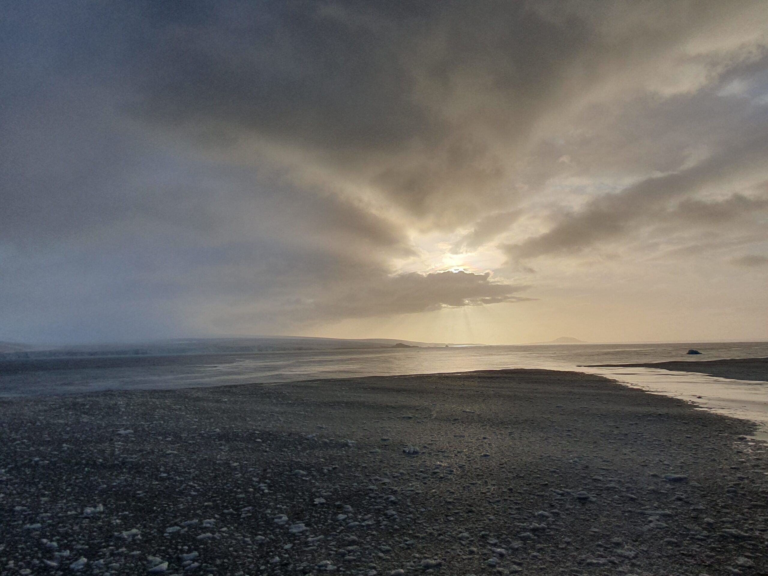 A group of clouds in the sky on a beach