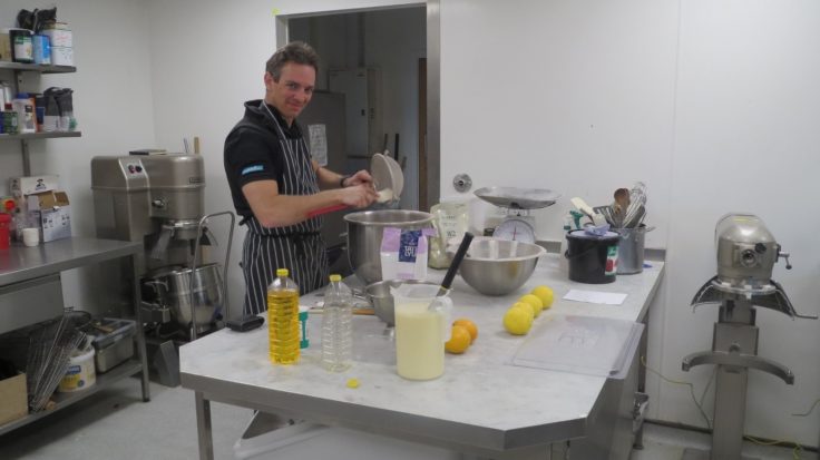 A man preparing food in a kitchen