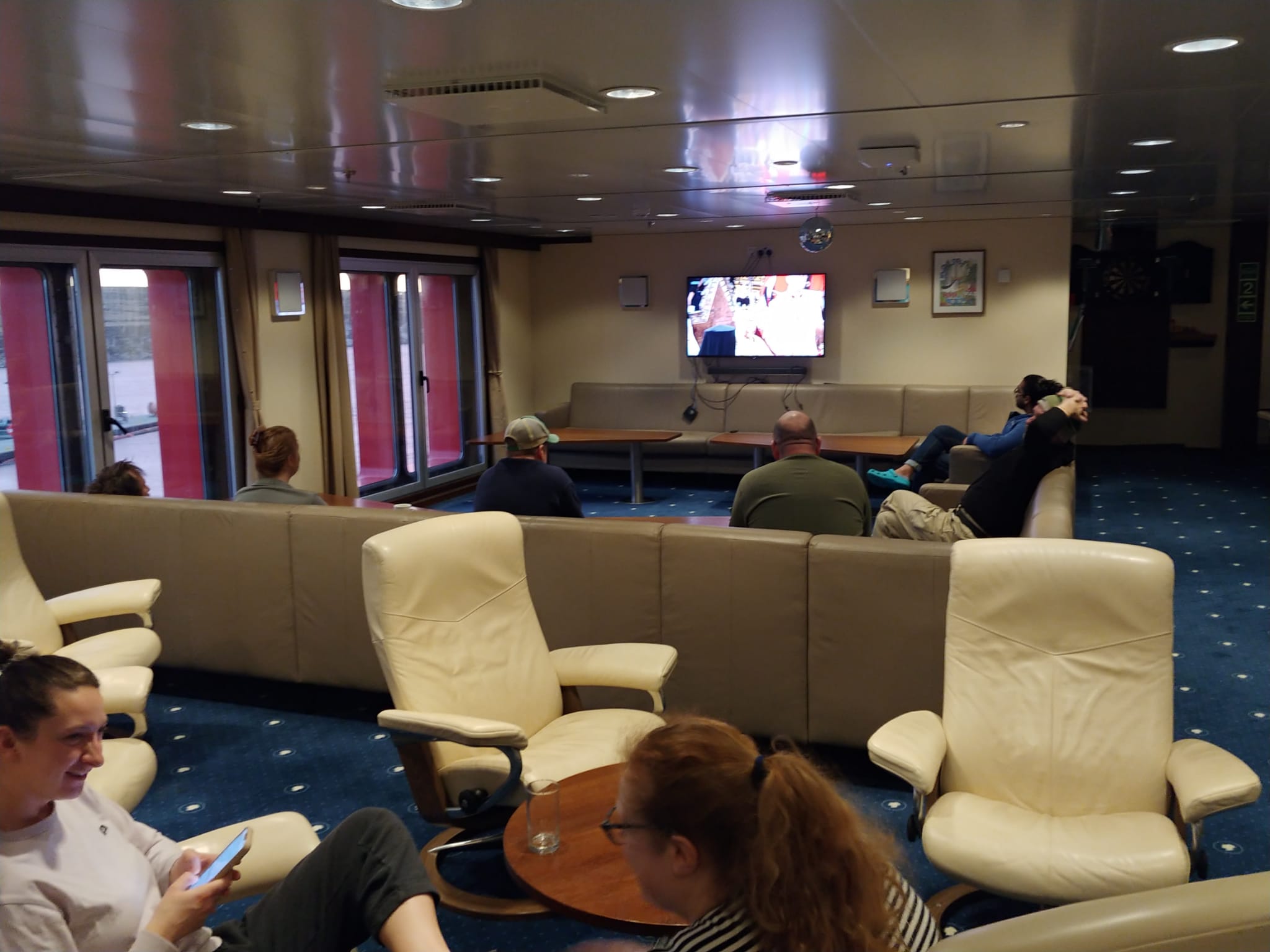 A group of people sitting around a living room