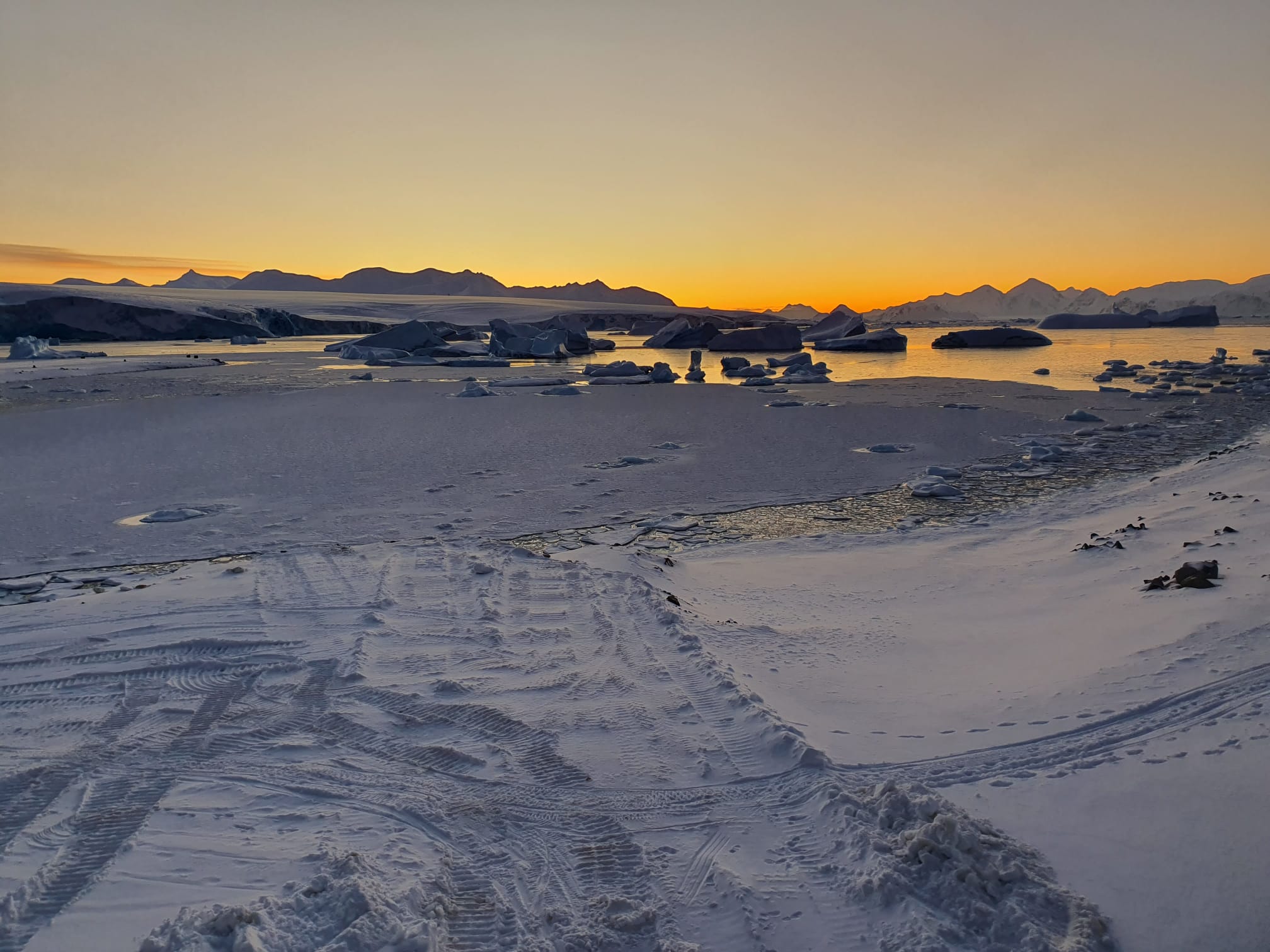 A sunset over a body of water