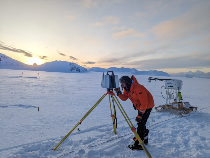 A man is cross country skiing in the snow