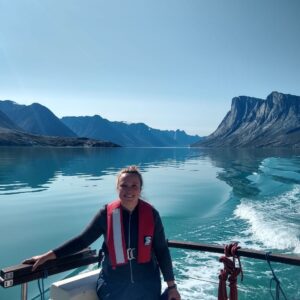 A man standing next to a body of water