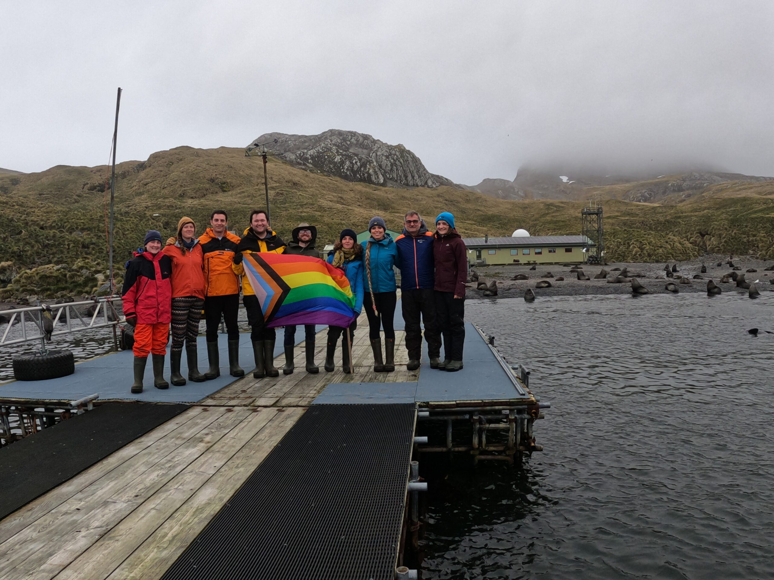Staff at Bird Island Research Station with the Pride Flag