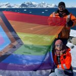 Photo of staff at Rothera Research Station displaying the Pride flag