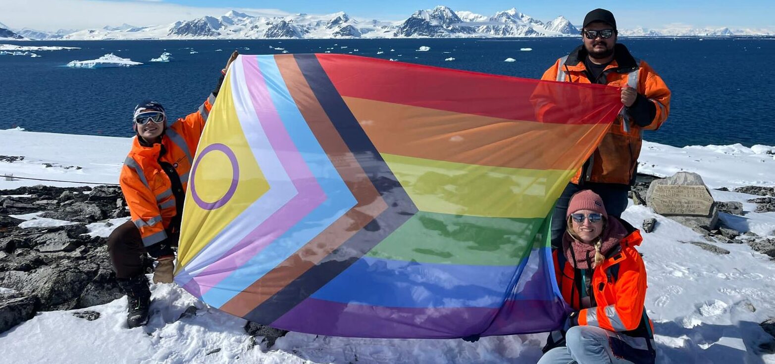 Photo of staff at Rothera Research Station displaying the Pride flag