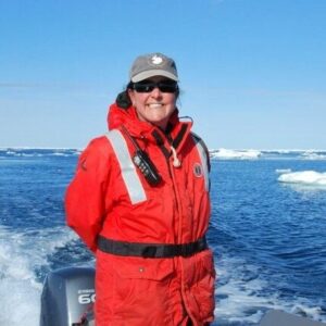 A man standing next to a body of water