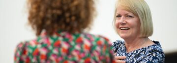 A woman smiling for the camera