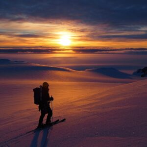 A man with a sunset in the background