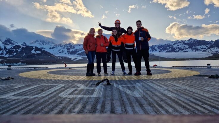 A group of people that are standing in the snow