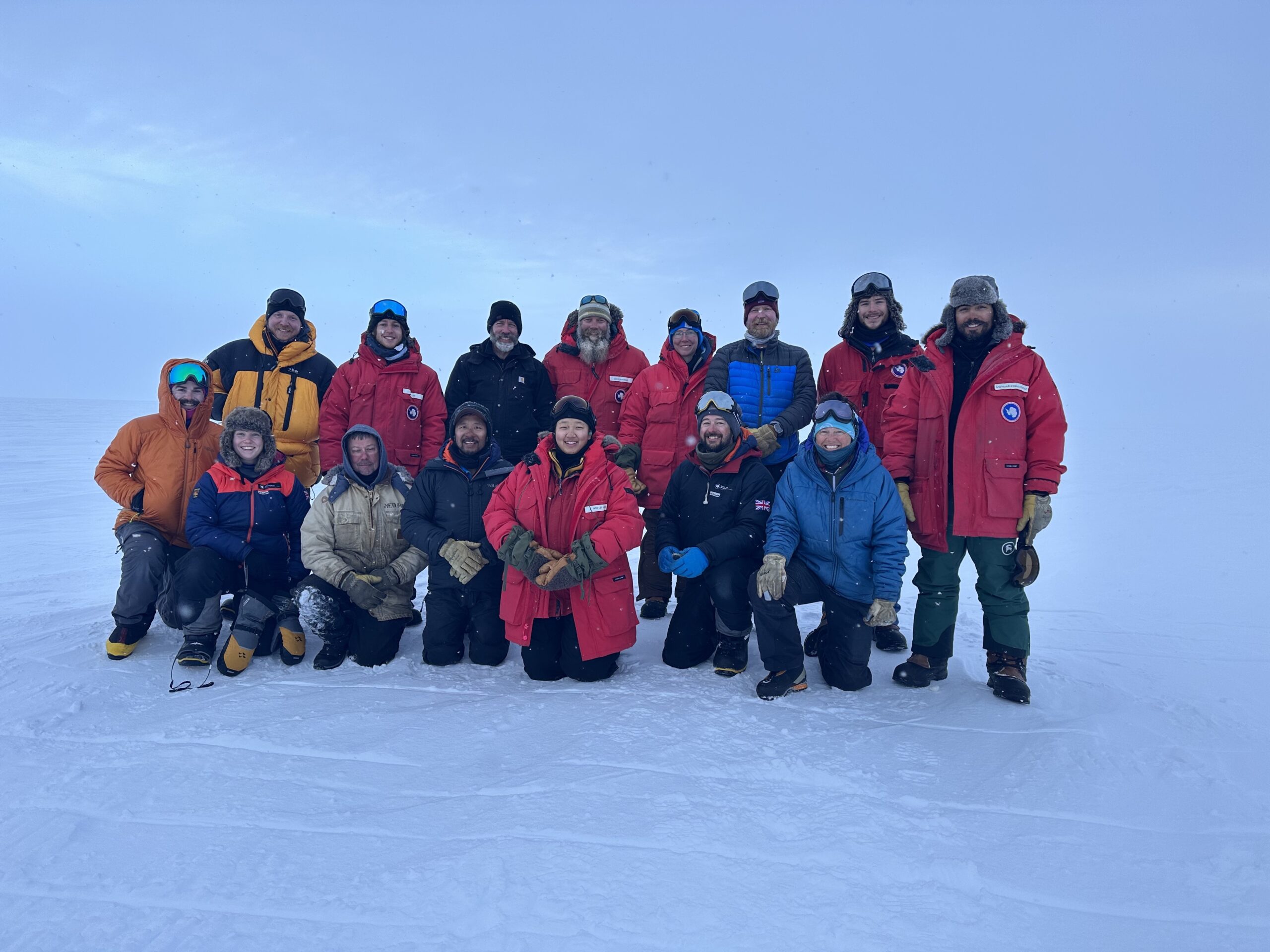 A group of people posing for a picture in the snow