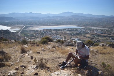 Photo of Claudette writing her field journal in Naxos, Greece