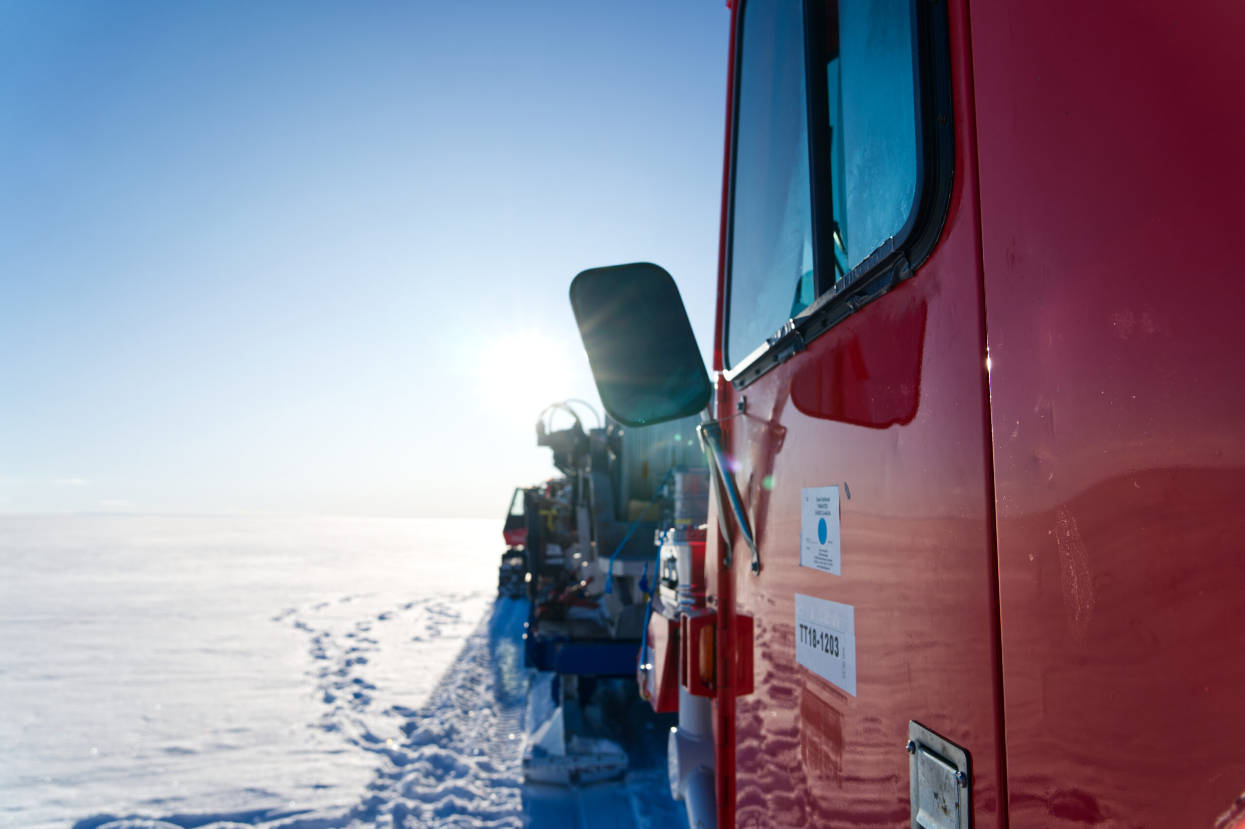 A red vehicle in the snow