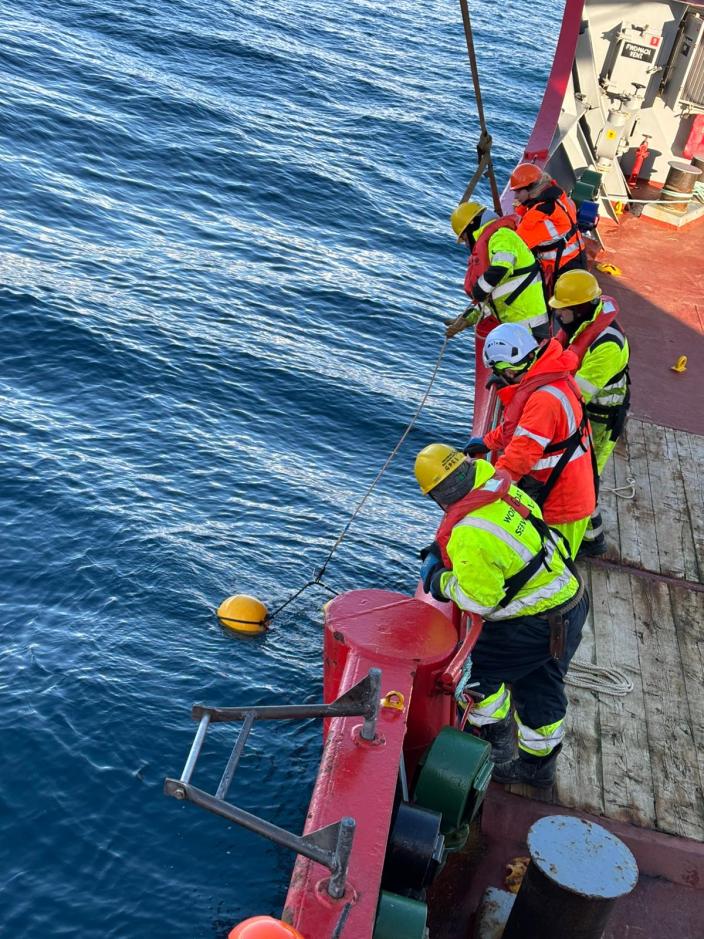 A group of people on a boat in the water
