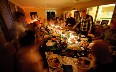 A group of people sitting at a table for dinner