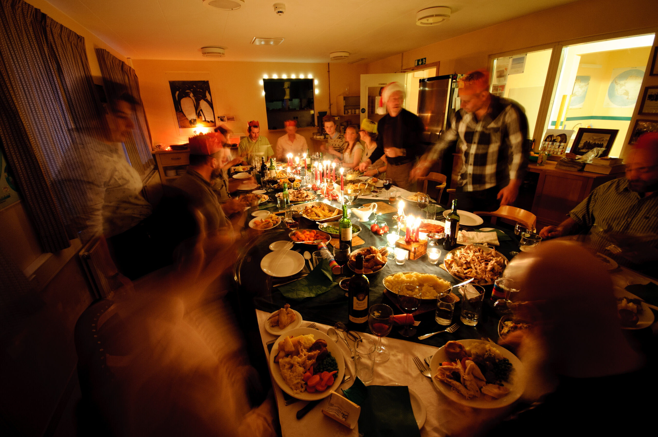 A group of people sitting at a table for dinner