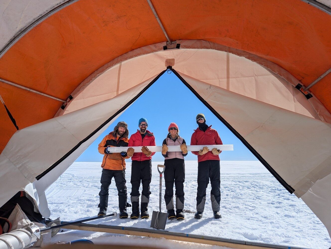 A group of people standing on a boat