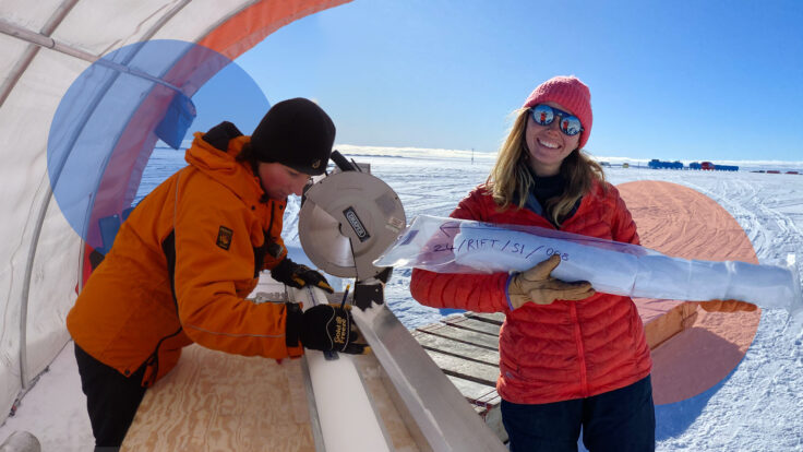 Scientists smiling holding an ice core