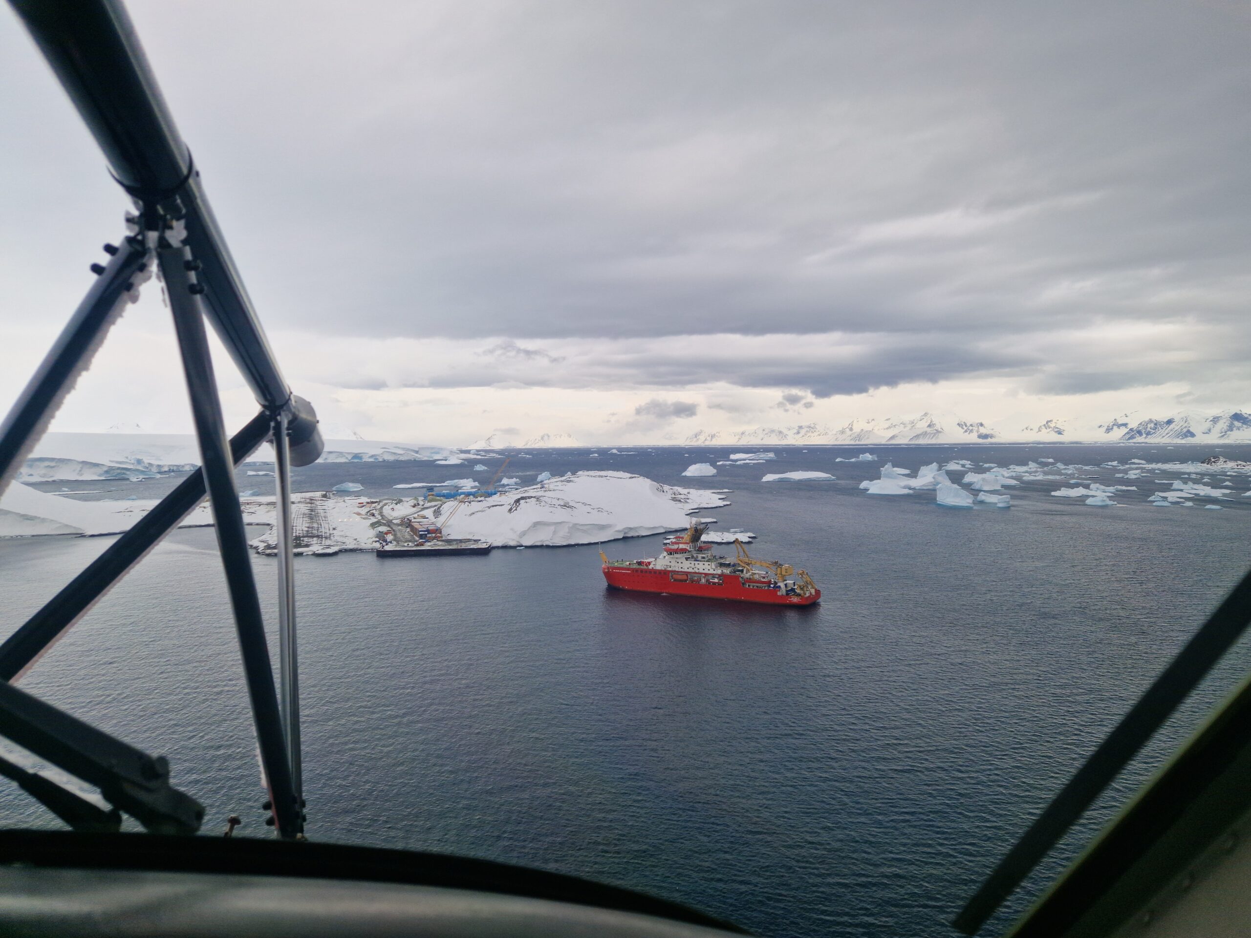 A photo of a ship and Rothera Research Station taken from a plane