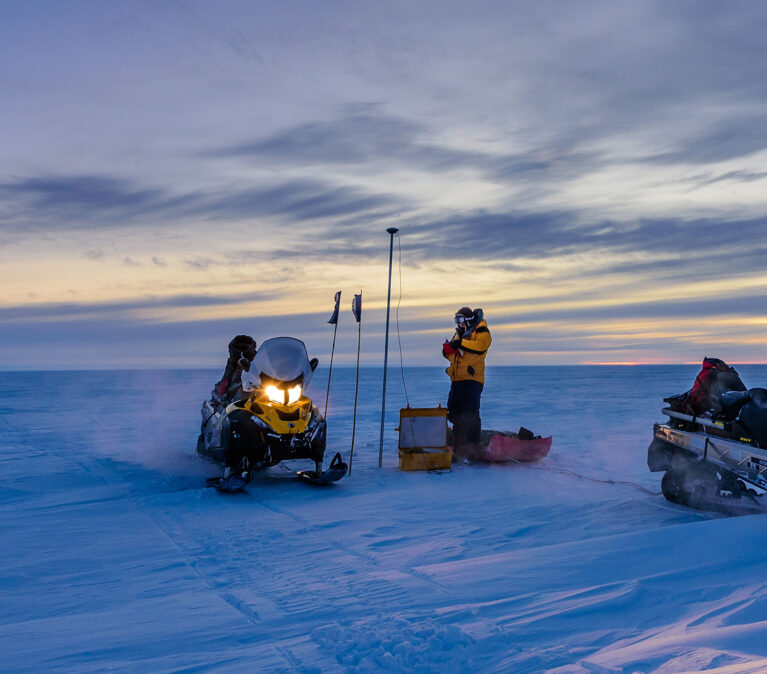 A pair of skidoos working in the deep Antarctic field.
