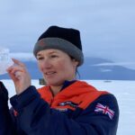 A woman standing in the snow