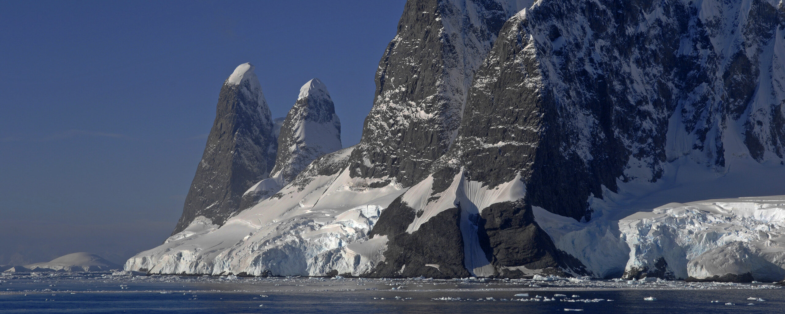 Snow covered mountains in the Lemaire Channel, West Antarctica