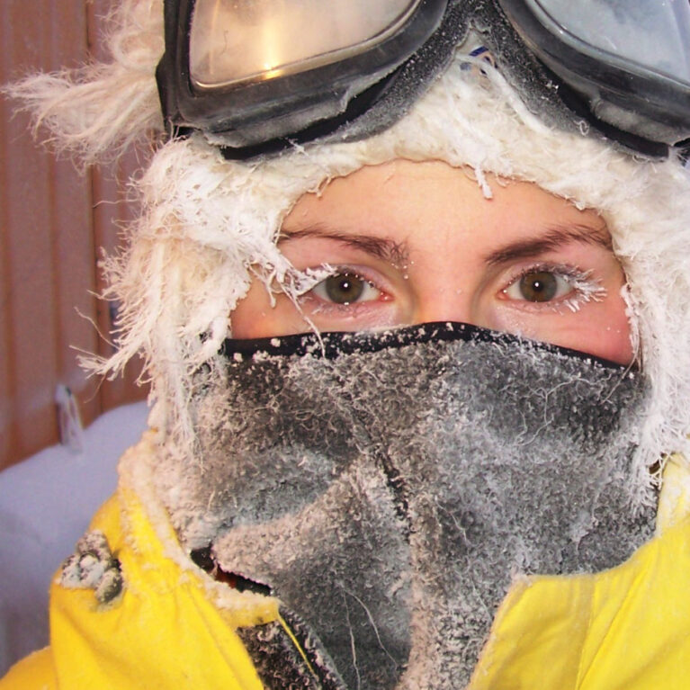 A person wearing a mask posing for the camera