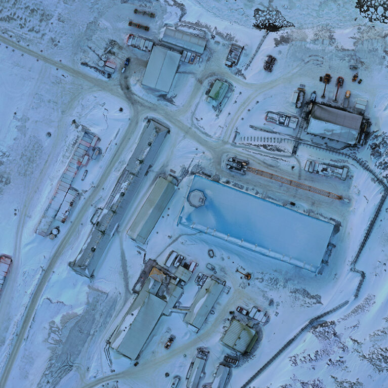 An aerial photograph of a snow blanketed research station