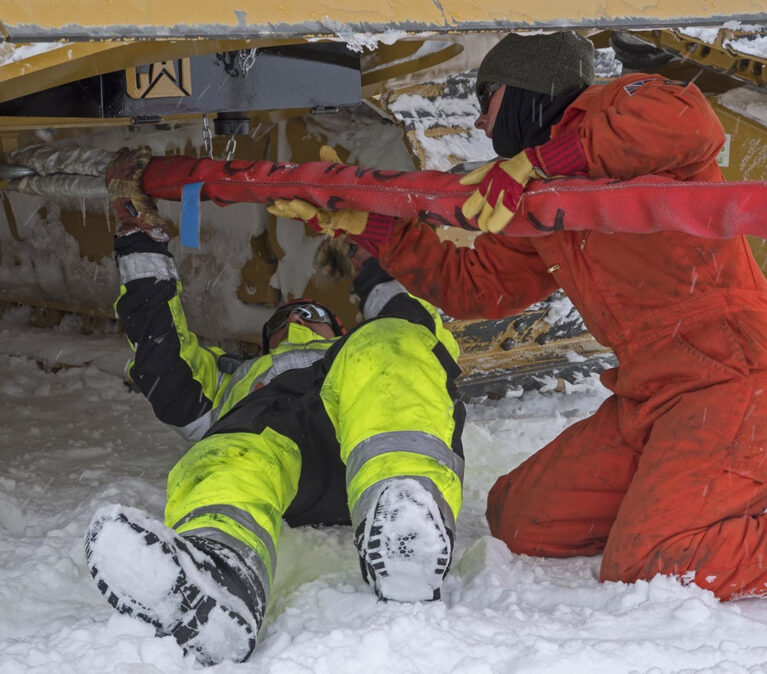 A person lying on a pile of snow