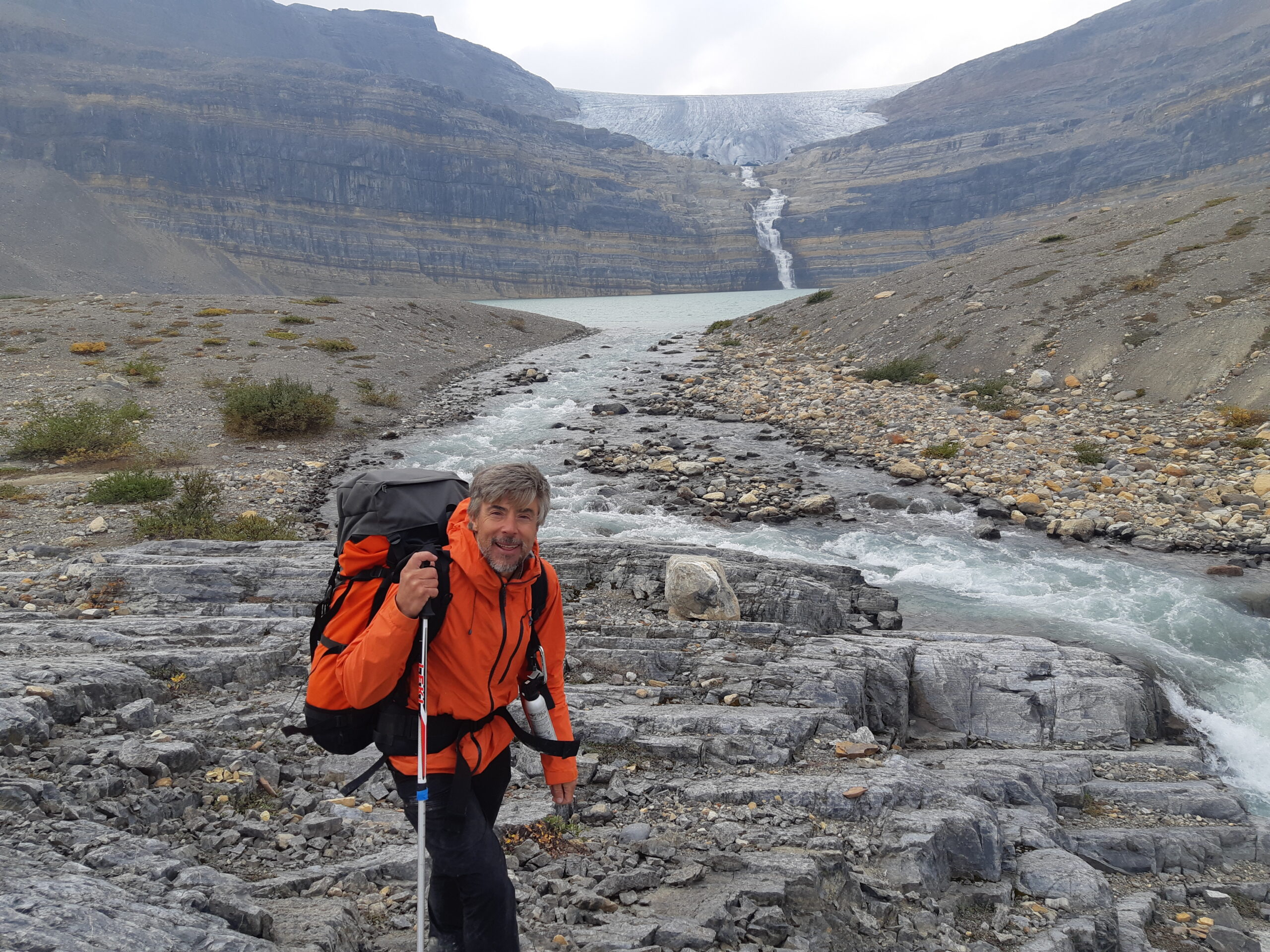 Dr Hamish Pritchard in the foreground and mountains in the background