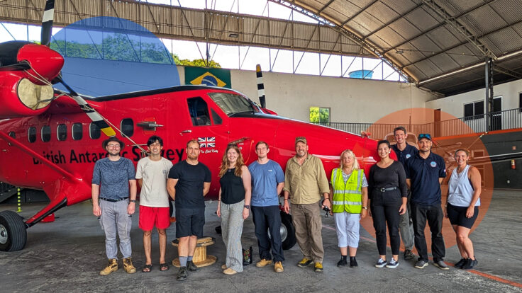 A group of people standing in front of a building