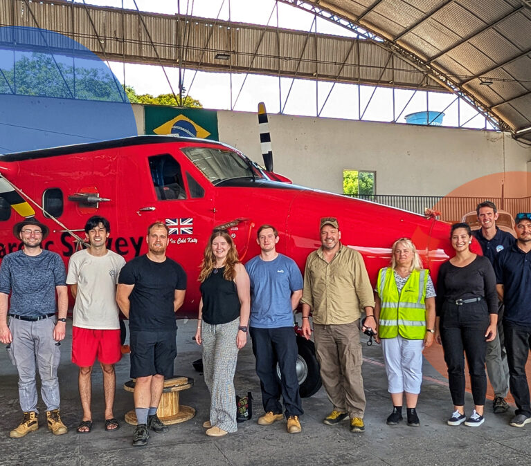 A group of people standing in front of a building