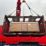 A large crane on the back of a boat