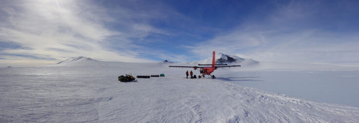 A airplane that is covered in snow
