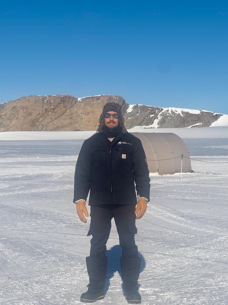 A man standing in the snow c