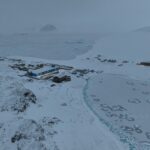 a building surrounded by snow