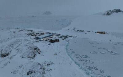 a building surrounded by snow