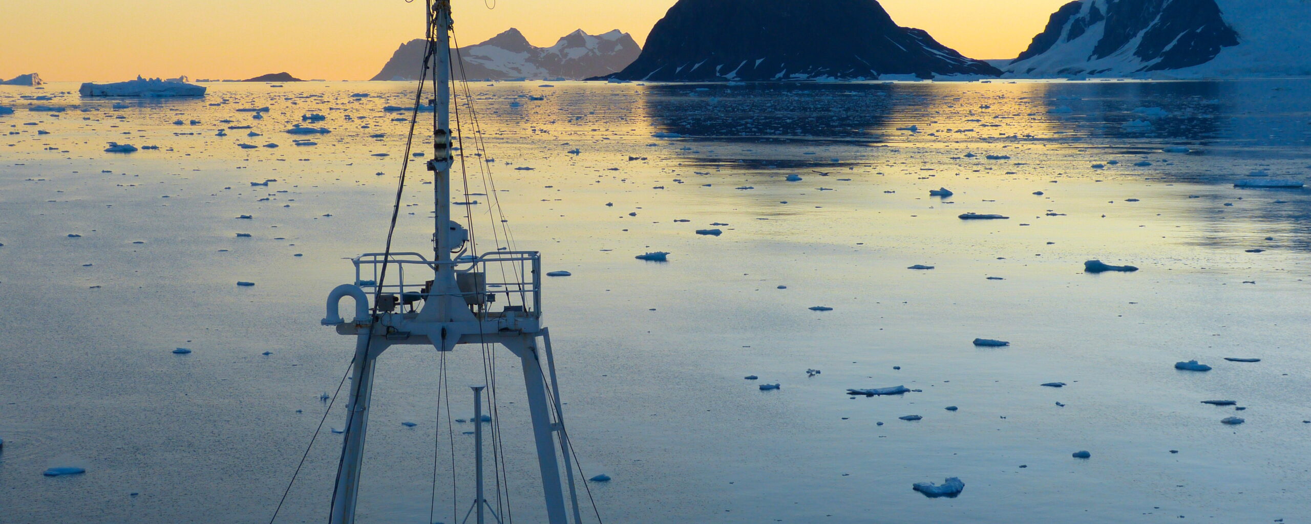 A boat is docked next to a body of water