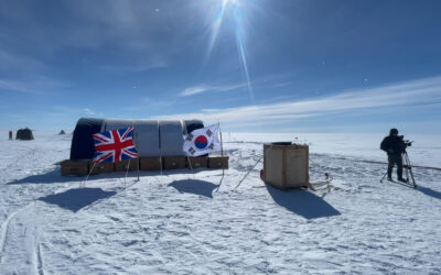 A group of people flying kites in the snow