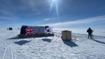 A group of people flying kites in the snow