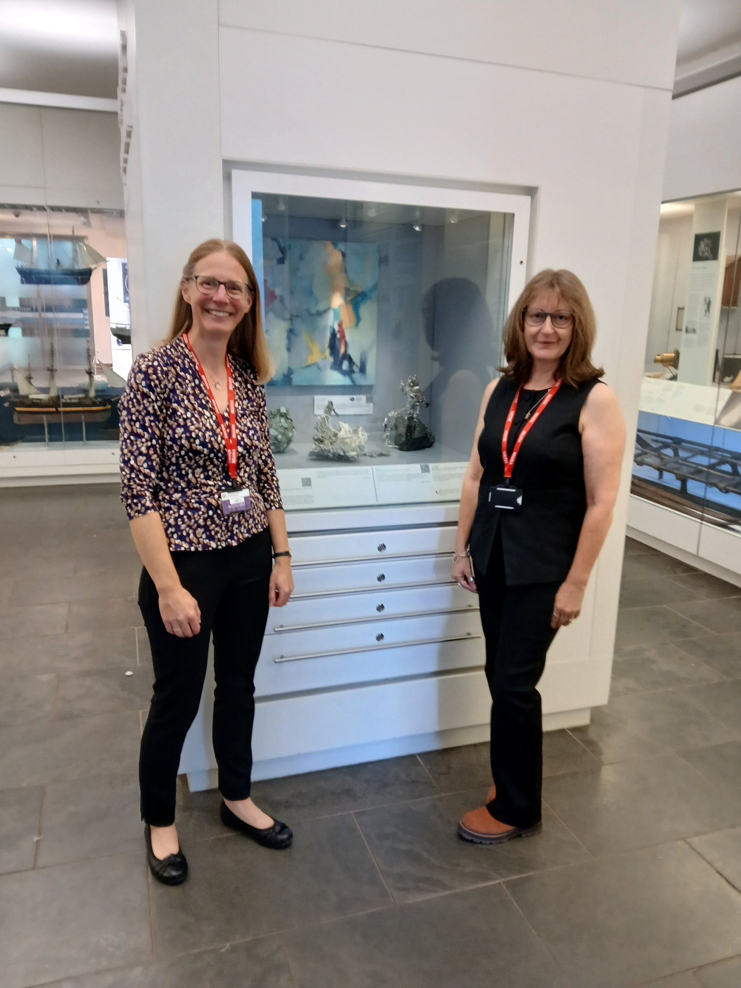 BAS Geochemist Dr Joanne Johnson (Left) and artist Rowan Huntley (Right) in front of exhibition